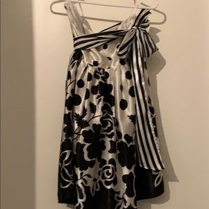 Satin black/ivory skirt w/ tie @waist. Knee length